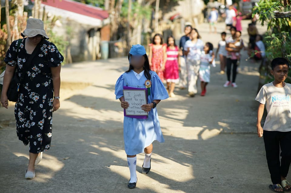 11-year-old student from Tinambac, Camarines Sur walking out of her graduation ceremony